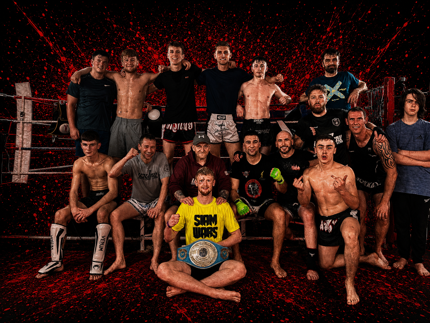 The Gorgie Fight Gym Muay Thai team in the ring with head coach John Craig and Alex MacGregor holding his championship belt