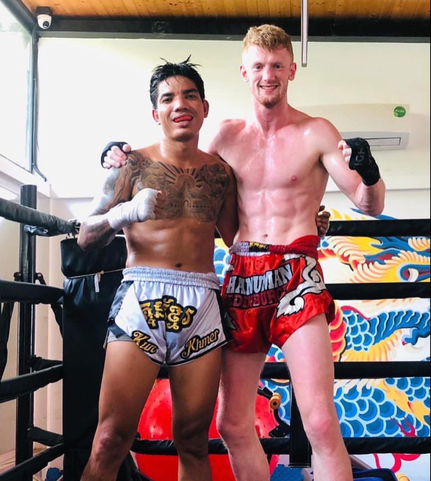Alex MacGregor with a fellow fighter in the ring in Thailand